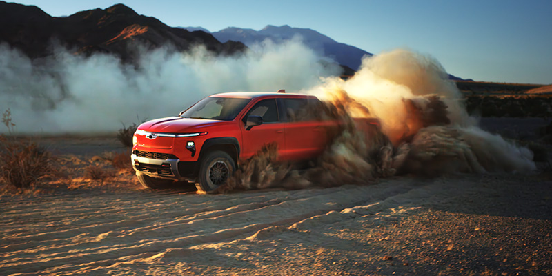 2026 Red Chevrolet Silverado EV showing it's off-road capabilities